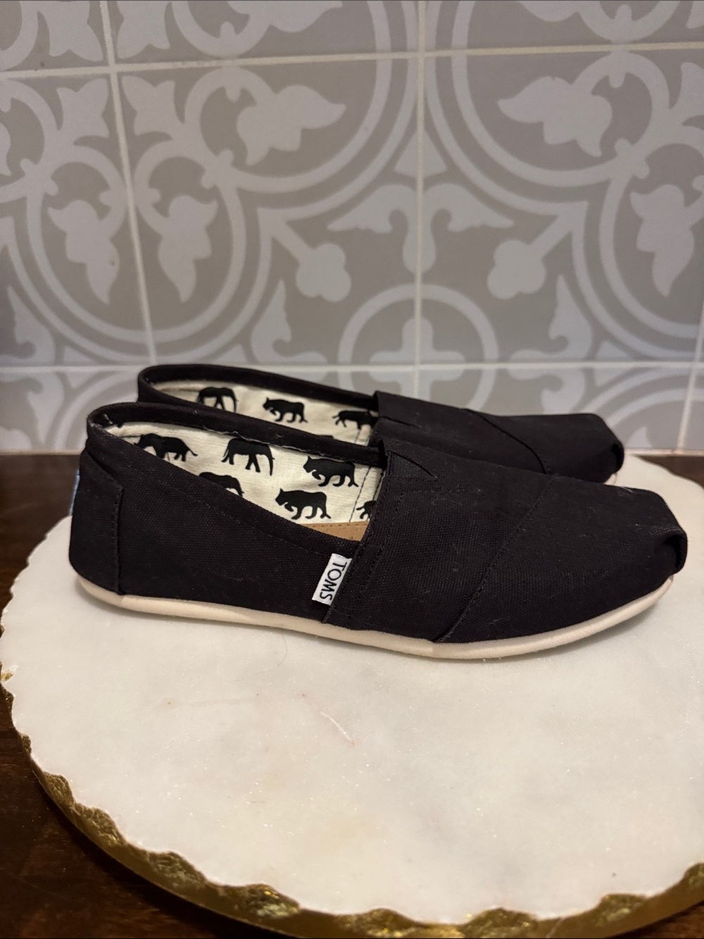 Toms Black Canvas Slip-On Shoes with Elephant Print Lining